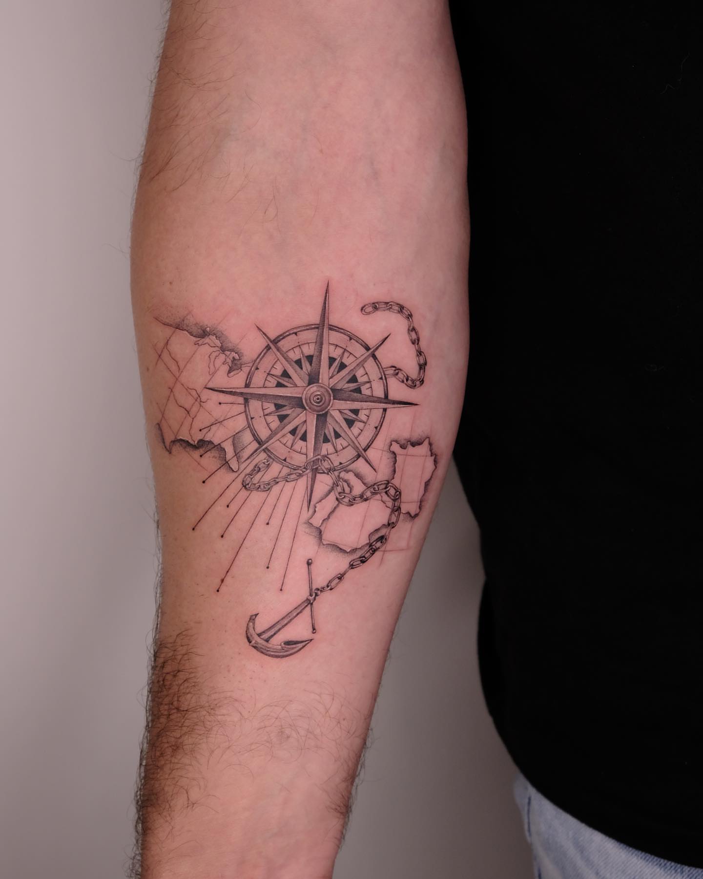 Compass and anchor geometric tattoo on the forearm by Zay - Realistic tattoo Artist