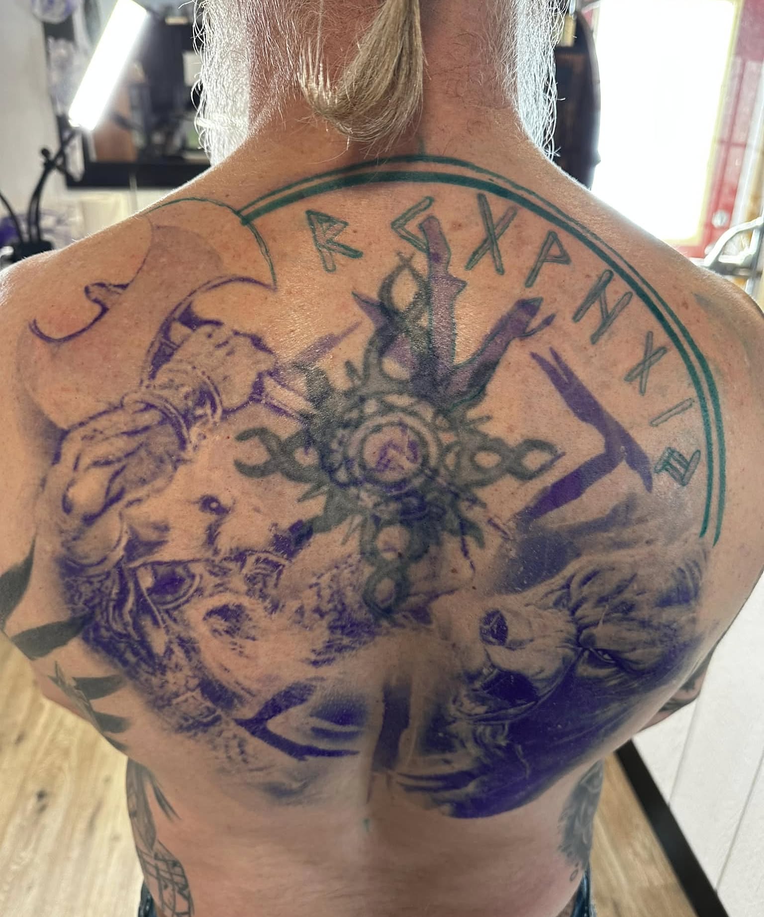 Goat and runes neo-traditional tattoo on the back by Nathan Froehlich