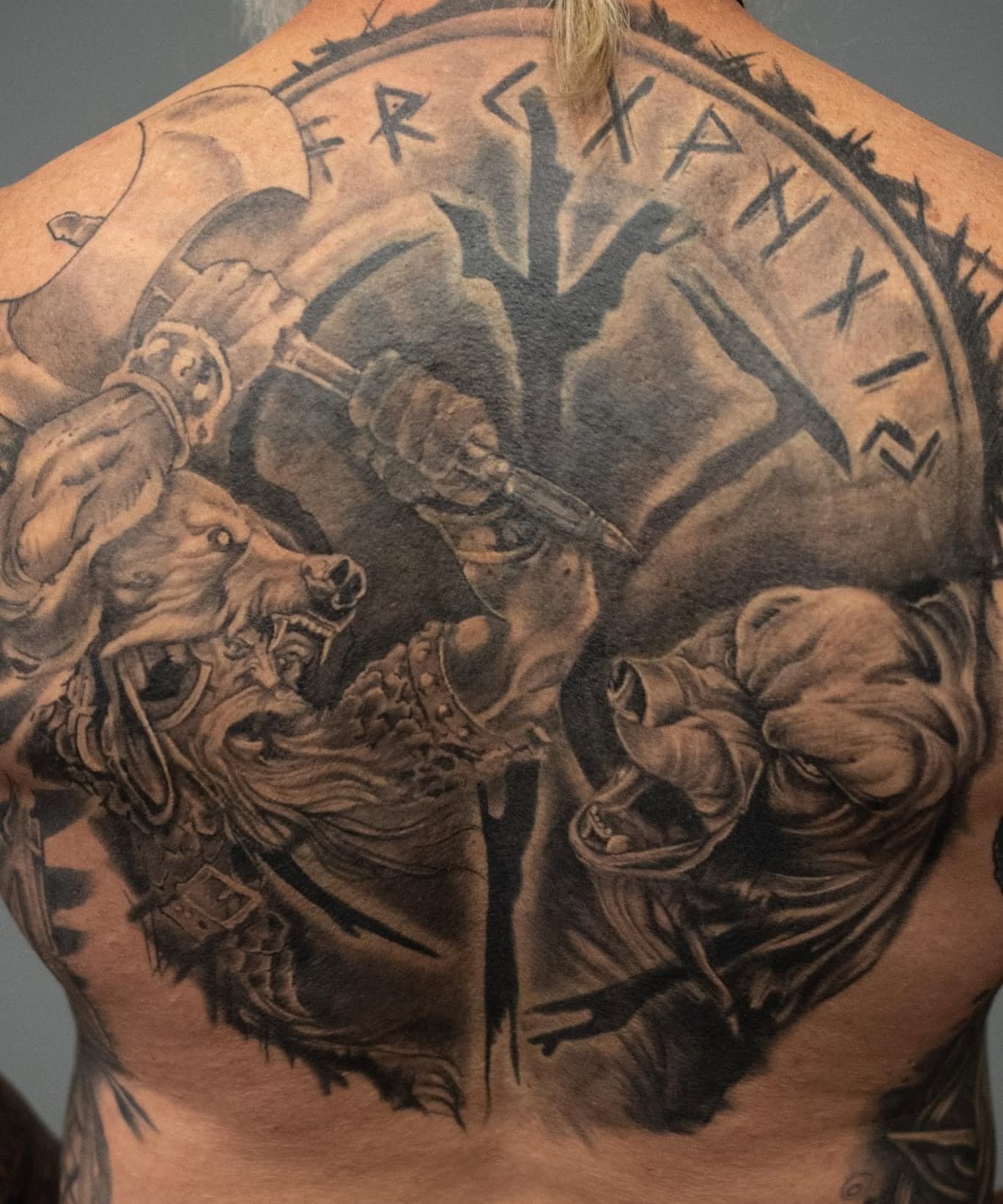 Warrior battle realism tattoo on the back by Nathan Froehlich