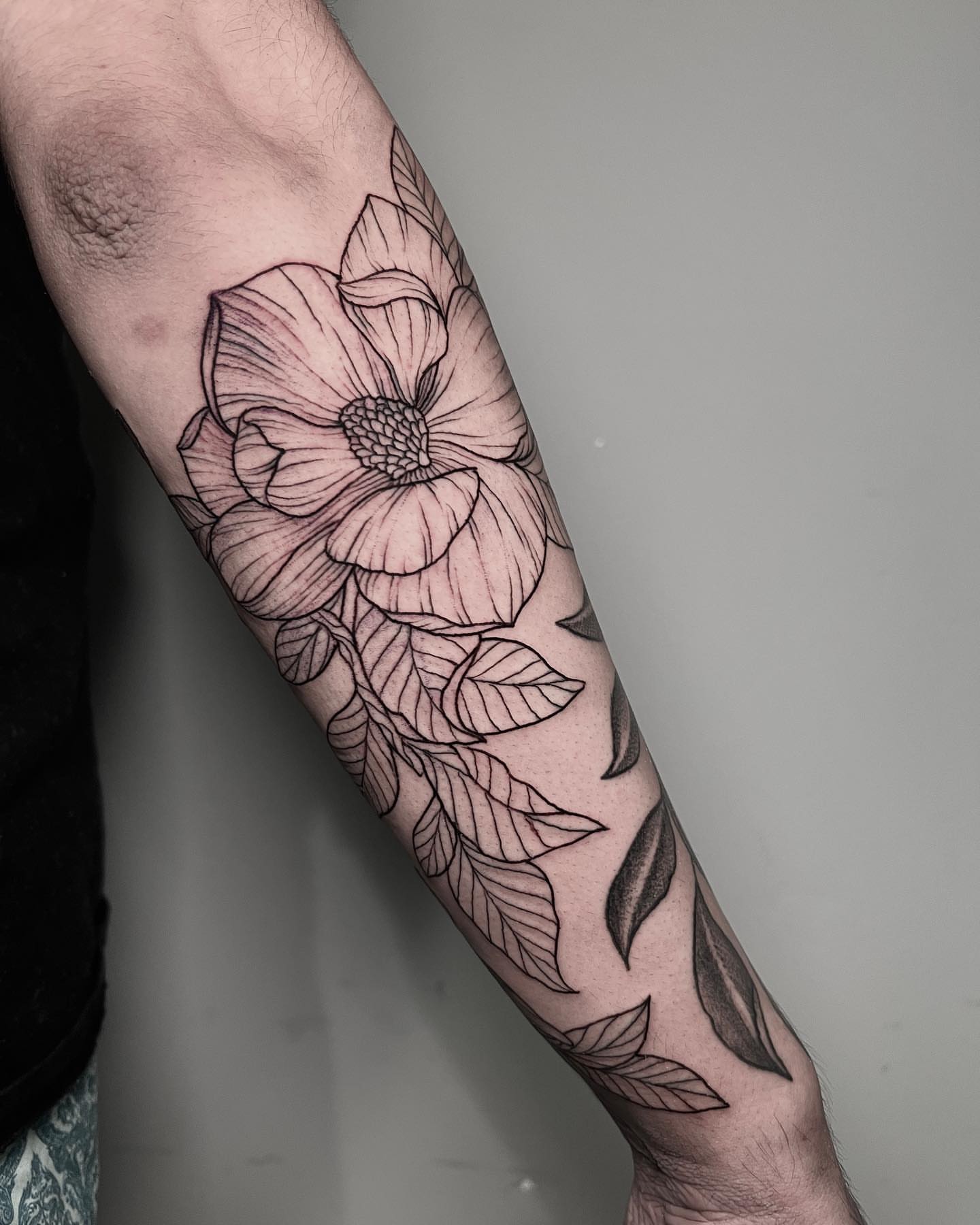 Flower black and grey tattoo on the forearm by Alex Shakuto Tattoo