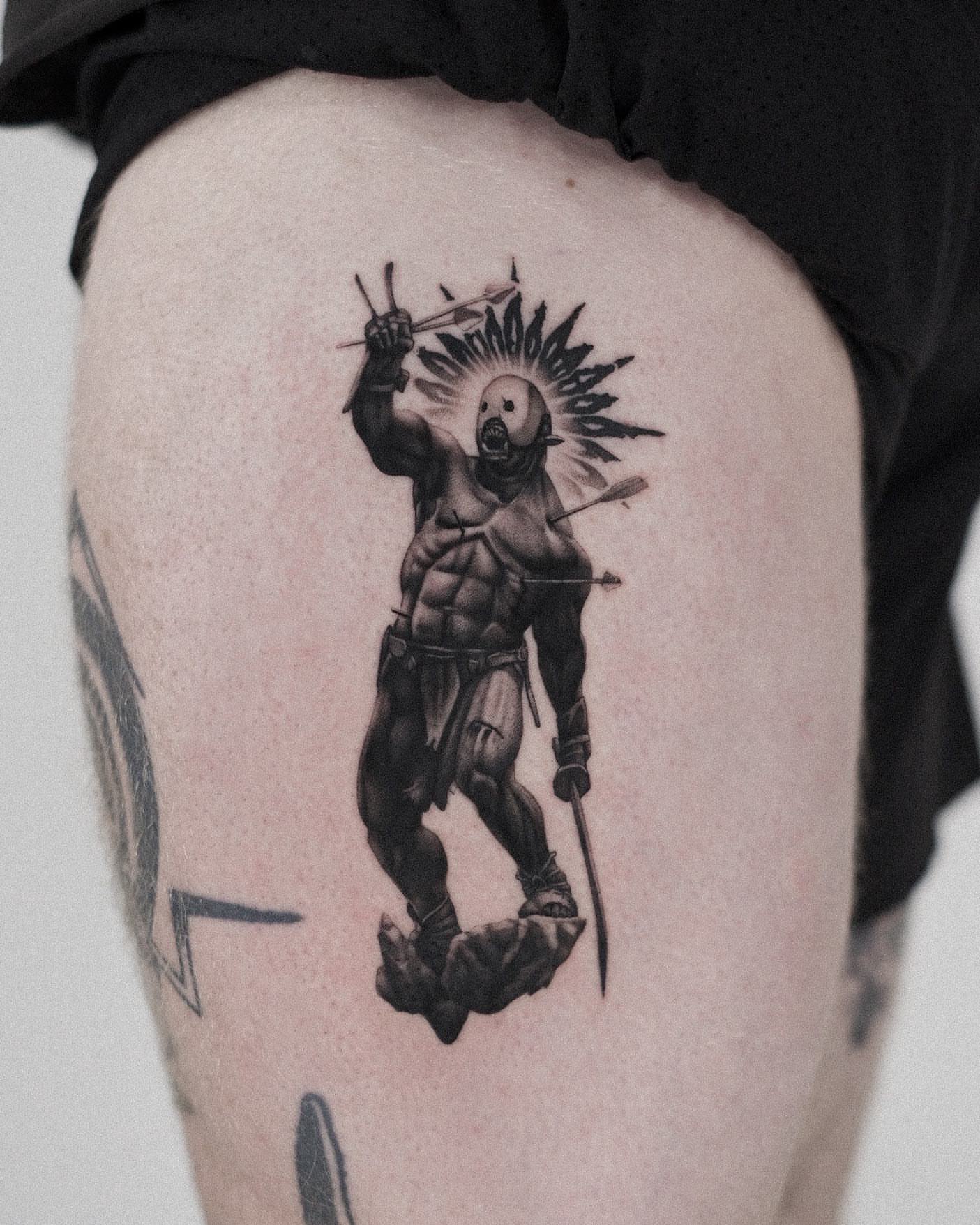 Warrior black and grey tattoo on the thigh by Oleksandr Moroz