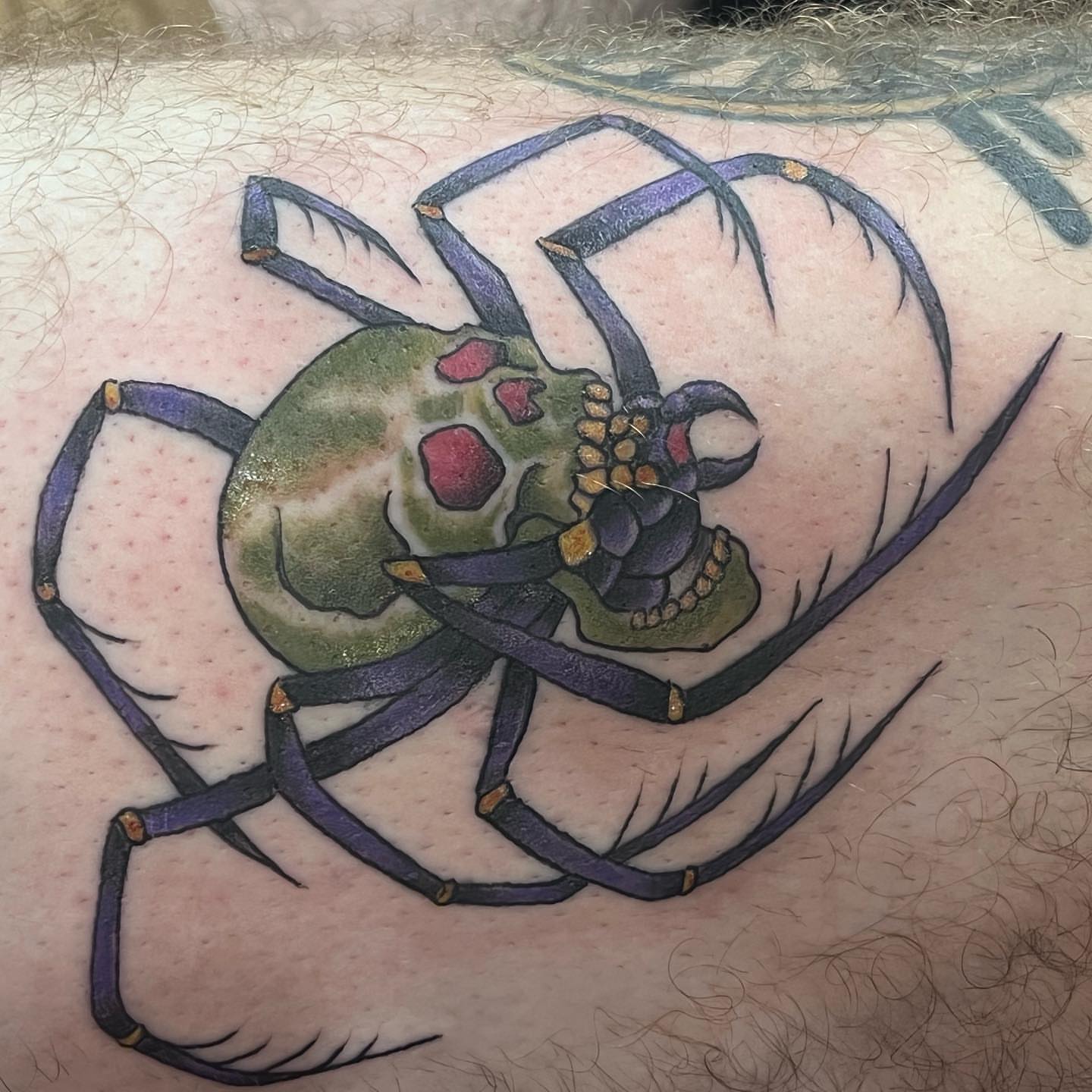 Spider skull dotwork tattoo on the thigh by IdleHandsFlex, New Orleans, Louisiana