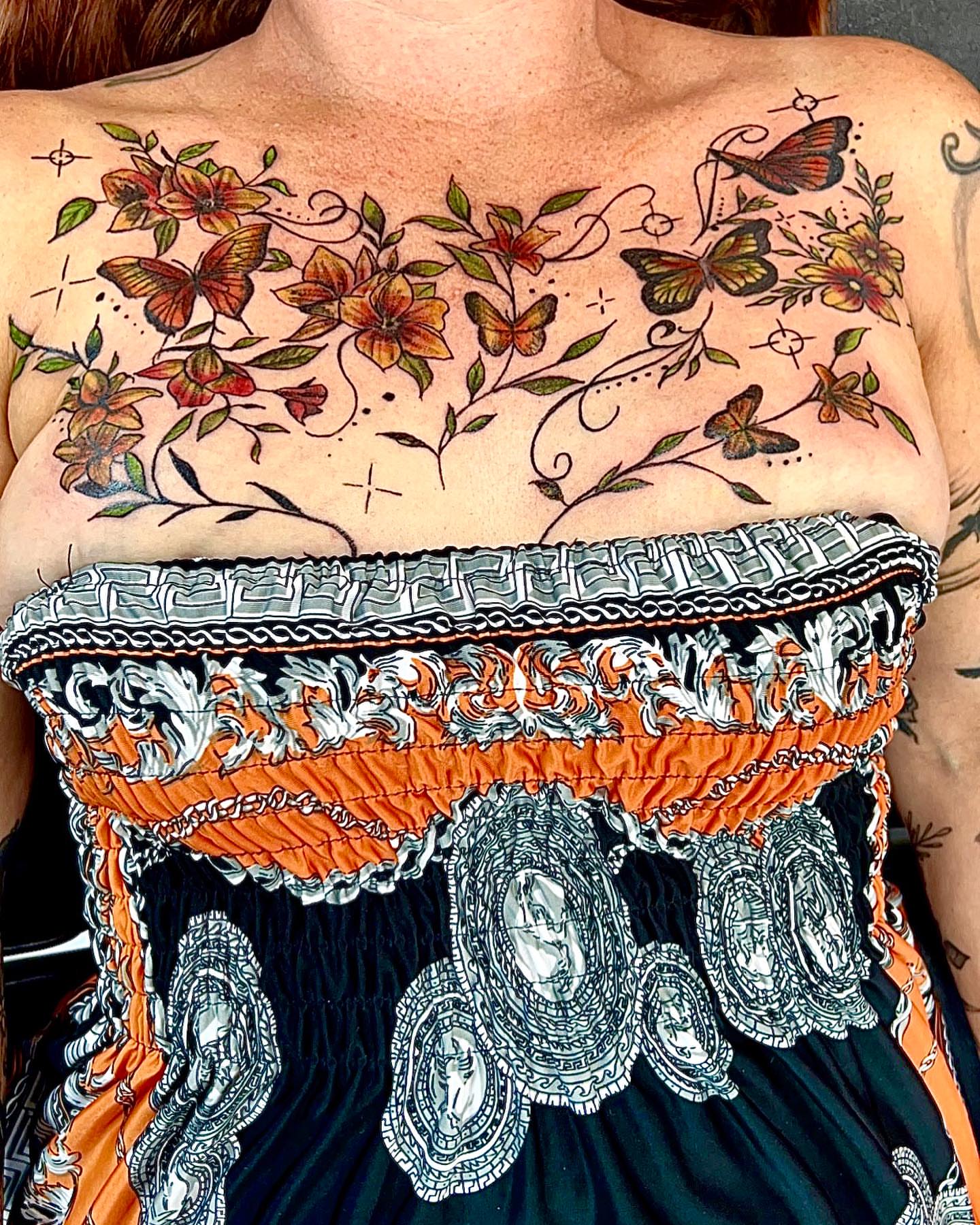 Floral butterflies American traditional tattoo on the chest by Dre Ortiz