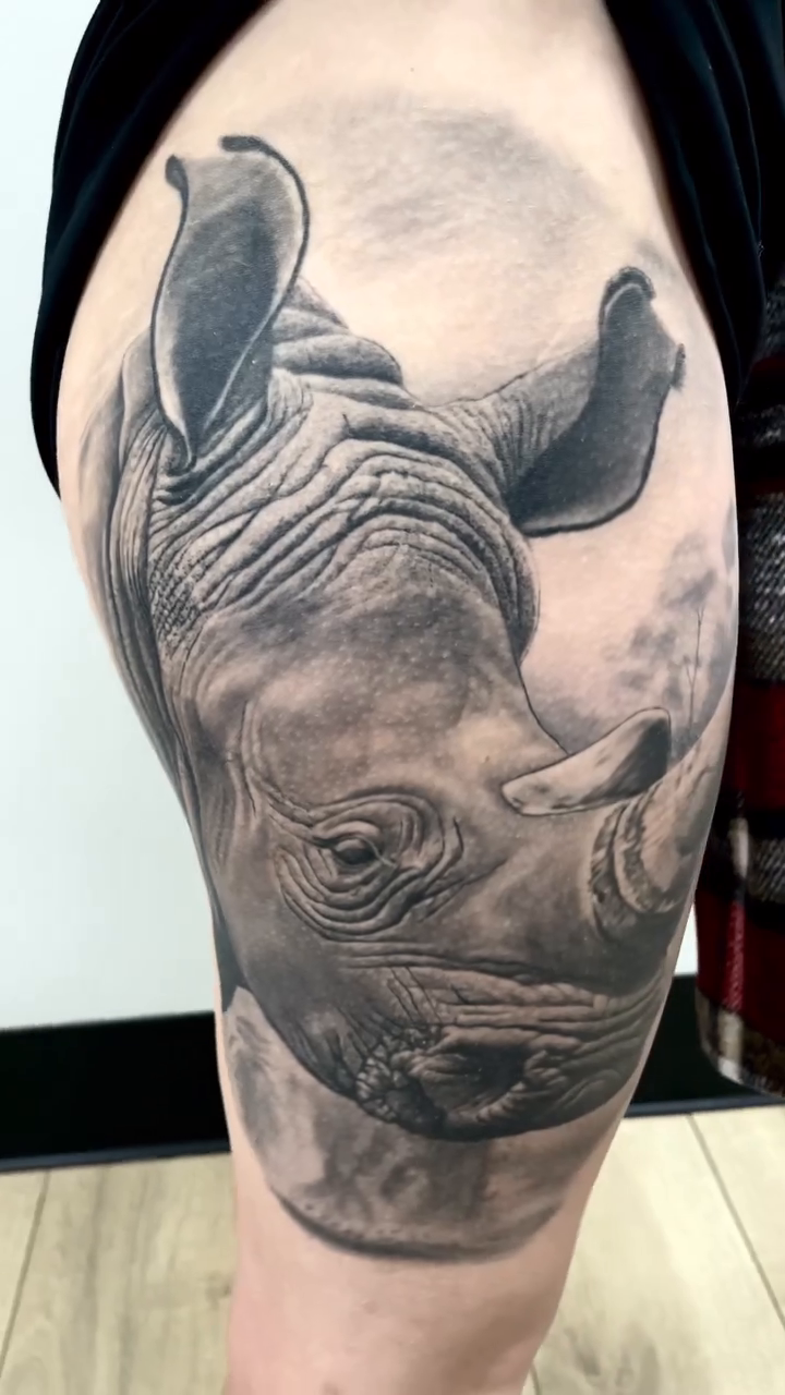 Rhinoceros head realism tattoo by Charlie