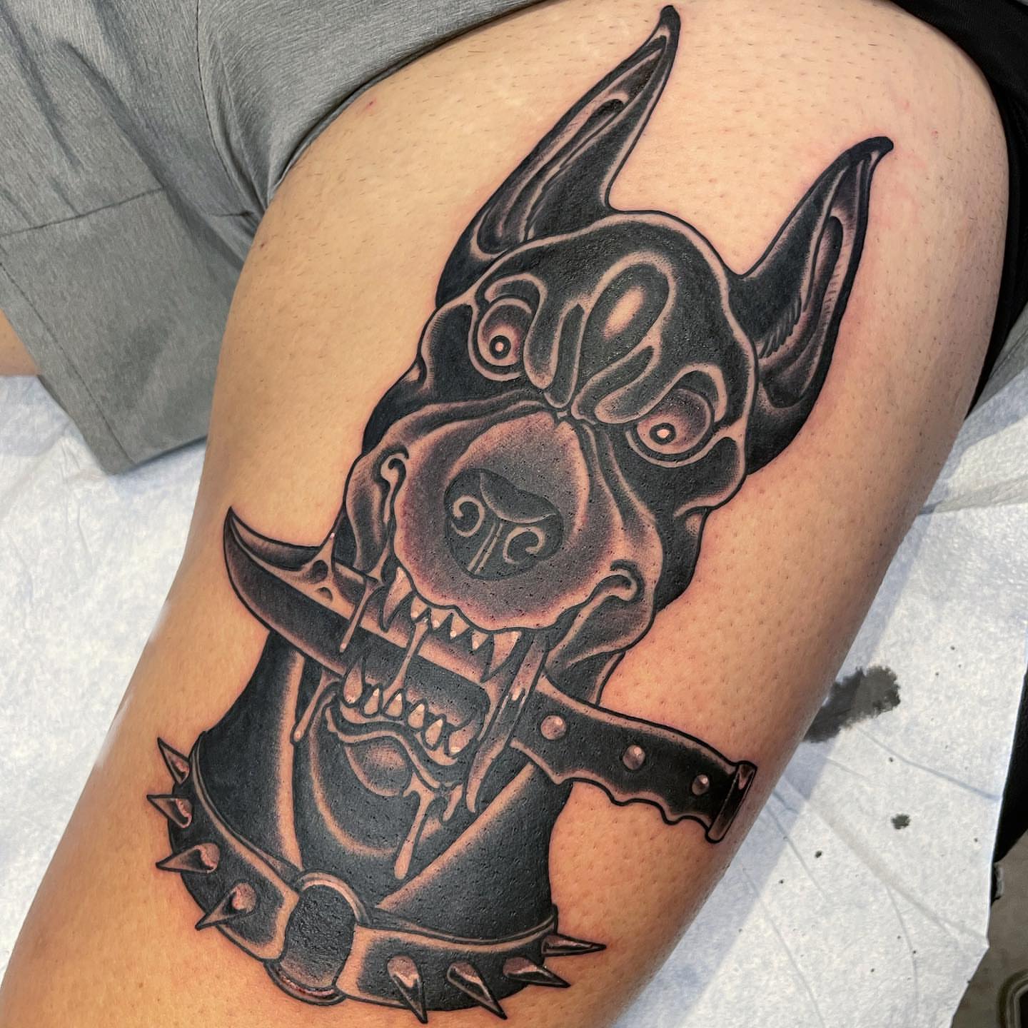 Dog black and grey tattoo on the thigh by Tony Medellin 7X9X