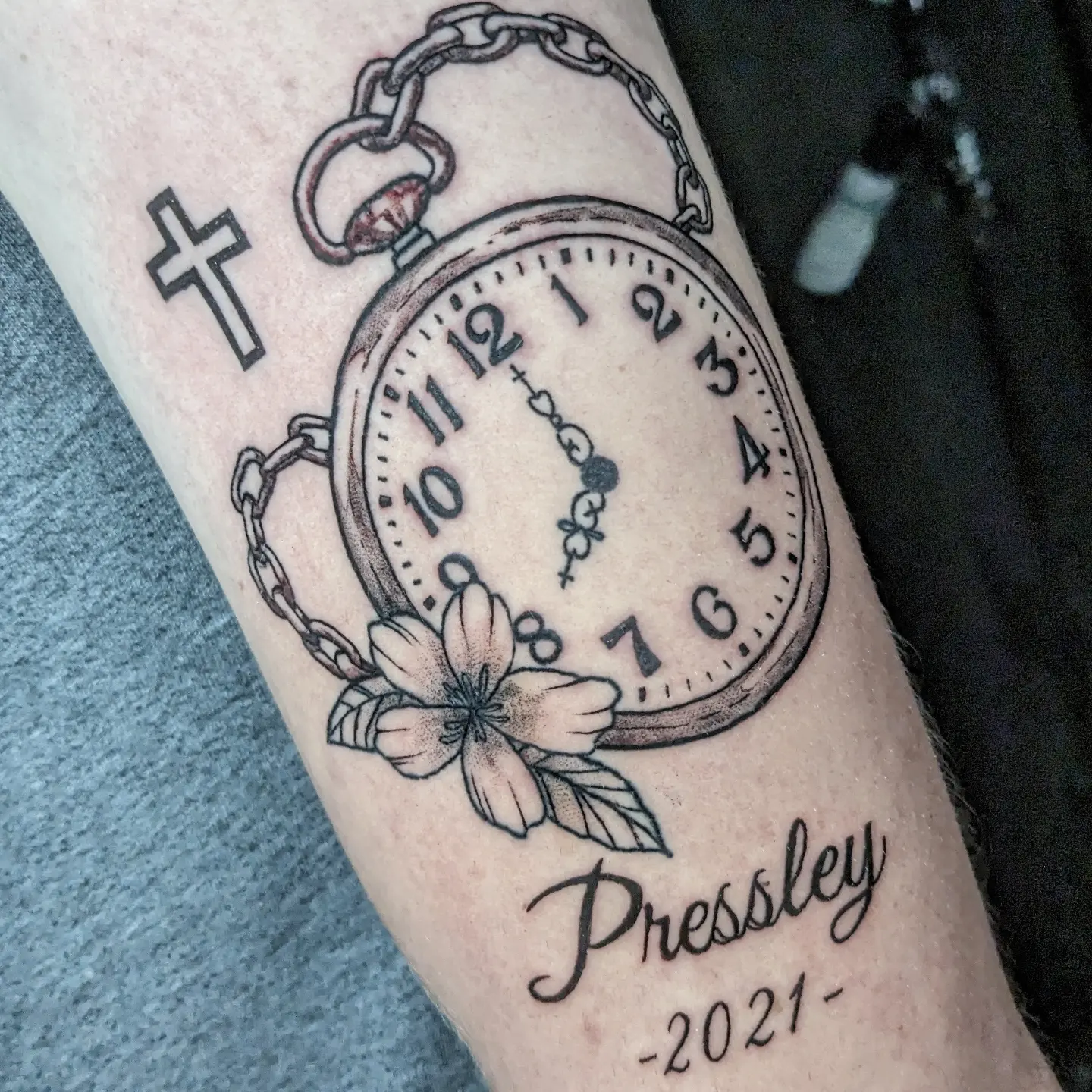 Pocket watch black and grey tattoo on the forearm by Seth Chitwood
