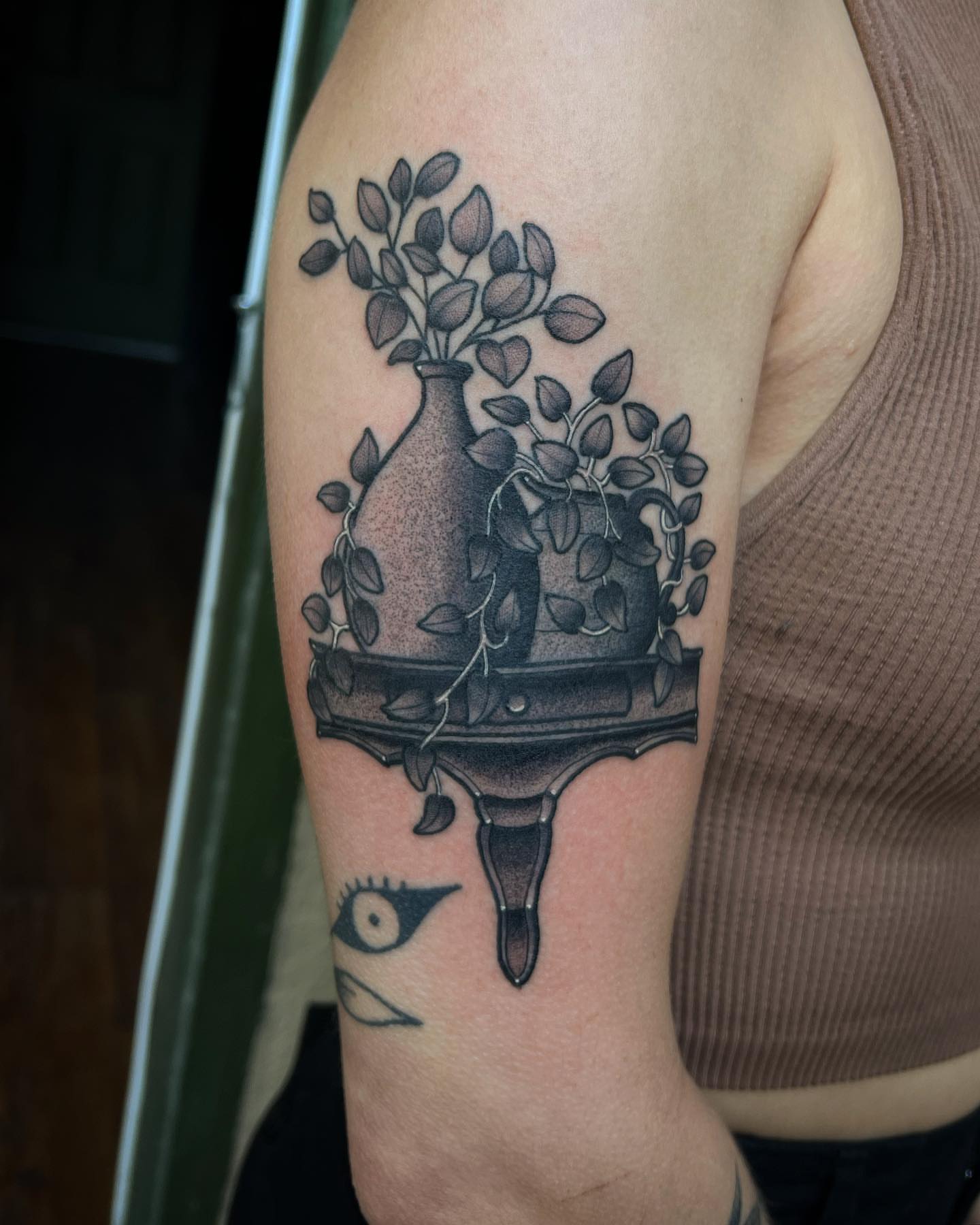 Vase with plant dotwork tattoo on the forearm by Daniel Patrick