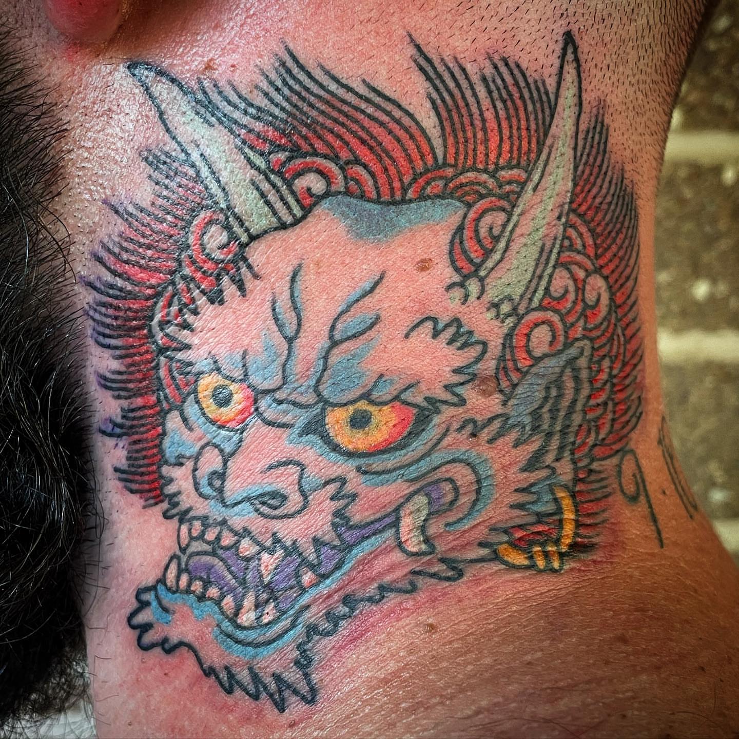Demon American traditional tattoo on the neck by Timothy Wood