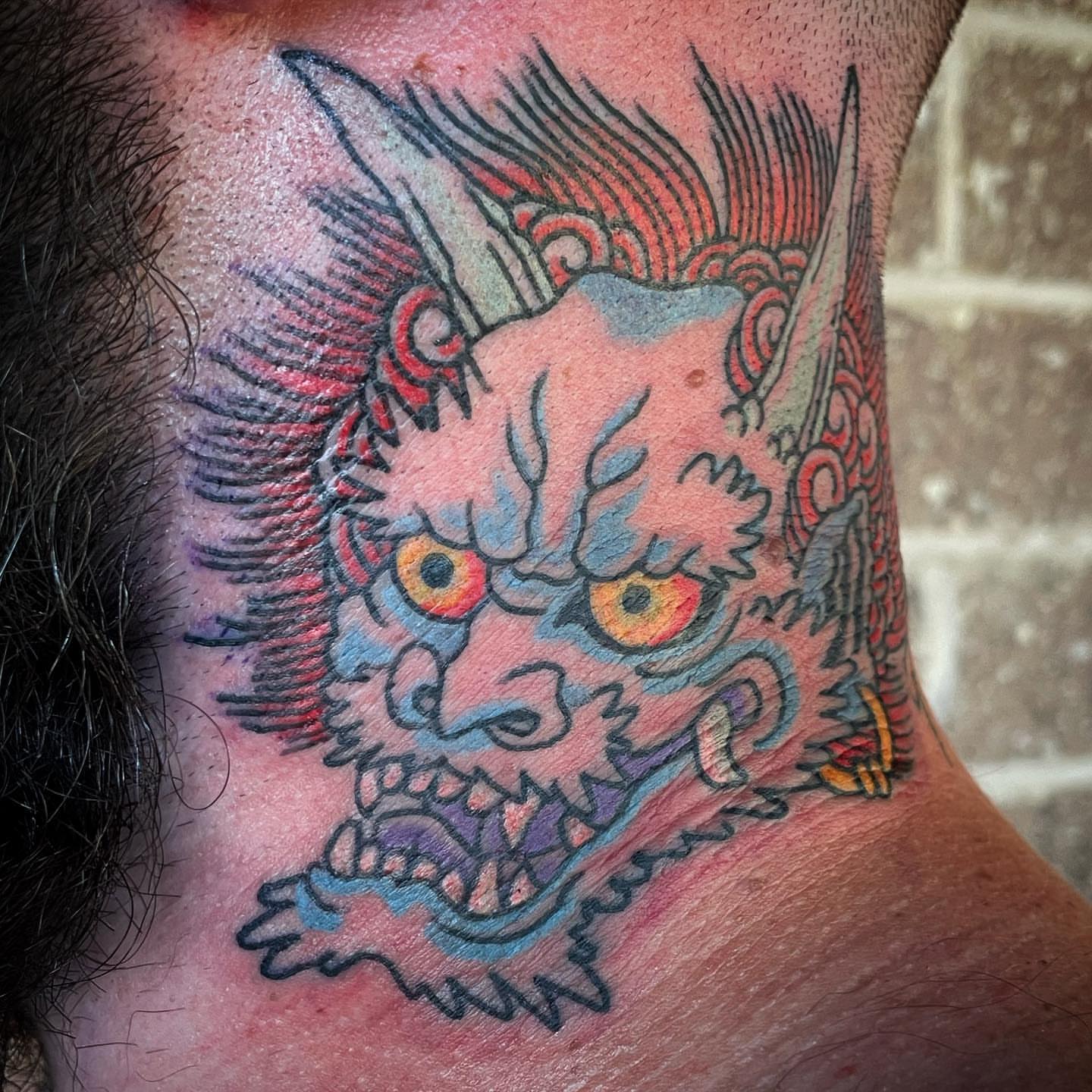 Demon head japanese irezumi tattoo on the neck by Timothy Wood