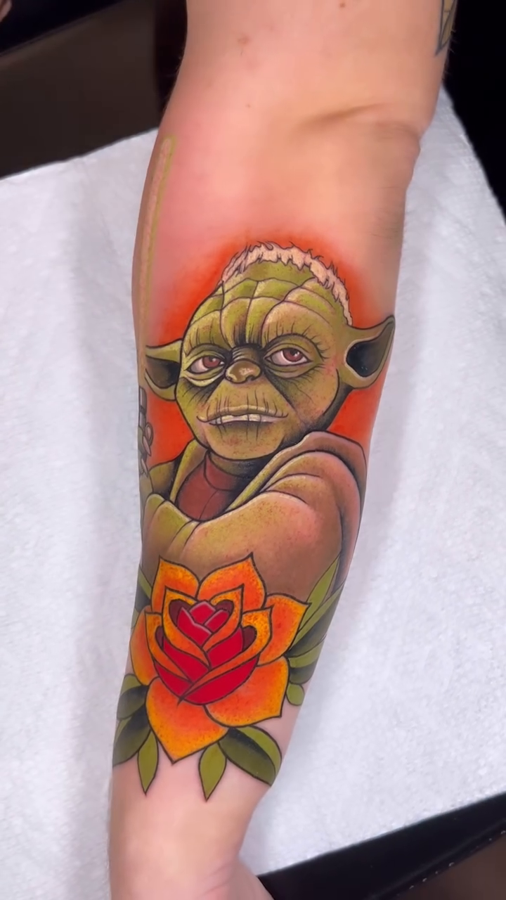 Yoda and a rose realism tattoo by Lexi Kniskern