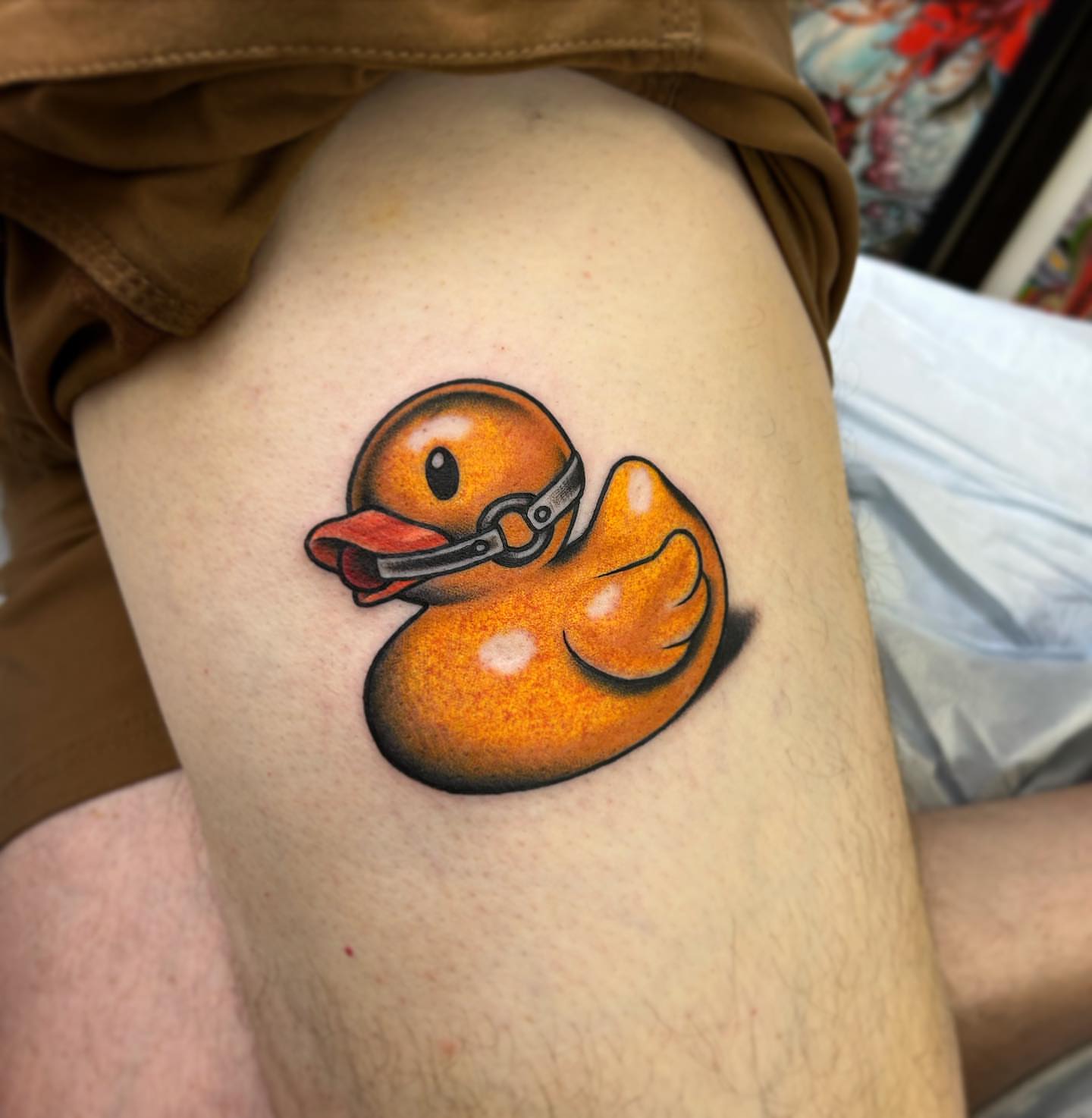 Rubber duck realism tattoo on the thigh by Pat Moser