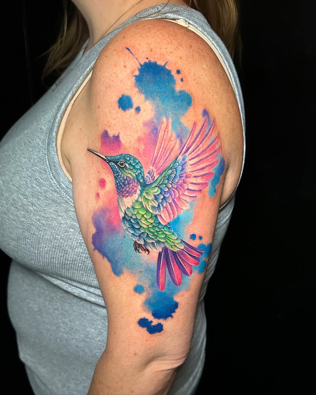Hummingbird with watercolor splashes watercolor tattoo on the shoulder by Violet Michelle Williams, Charlotte, North Carolina