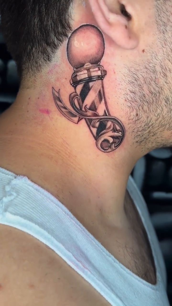 Barber pole realism tattoo by Adrian Dominguez, Las Vegas, Nevada