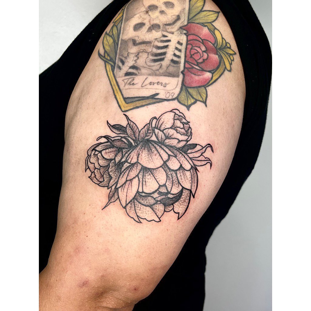 Peony American traditional tattoo on the shoulder by Jelly