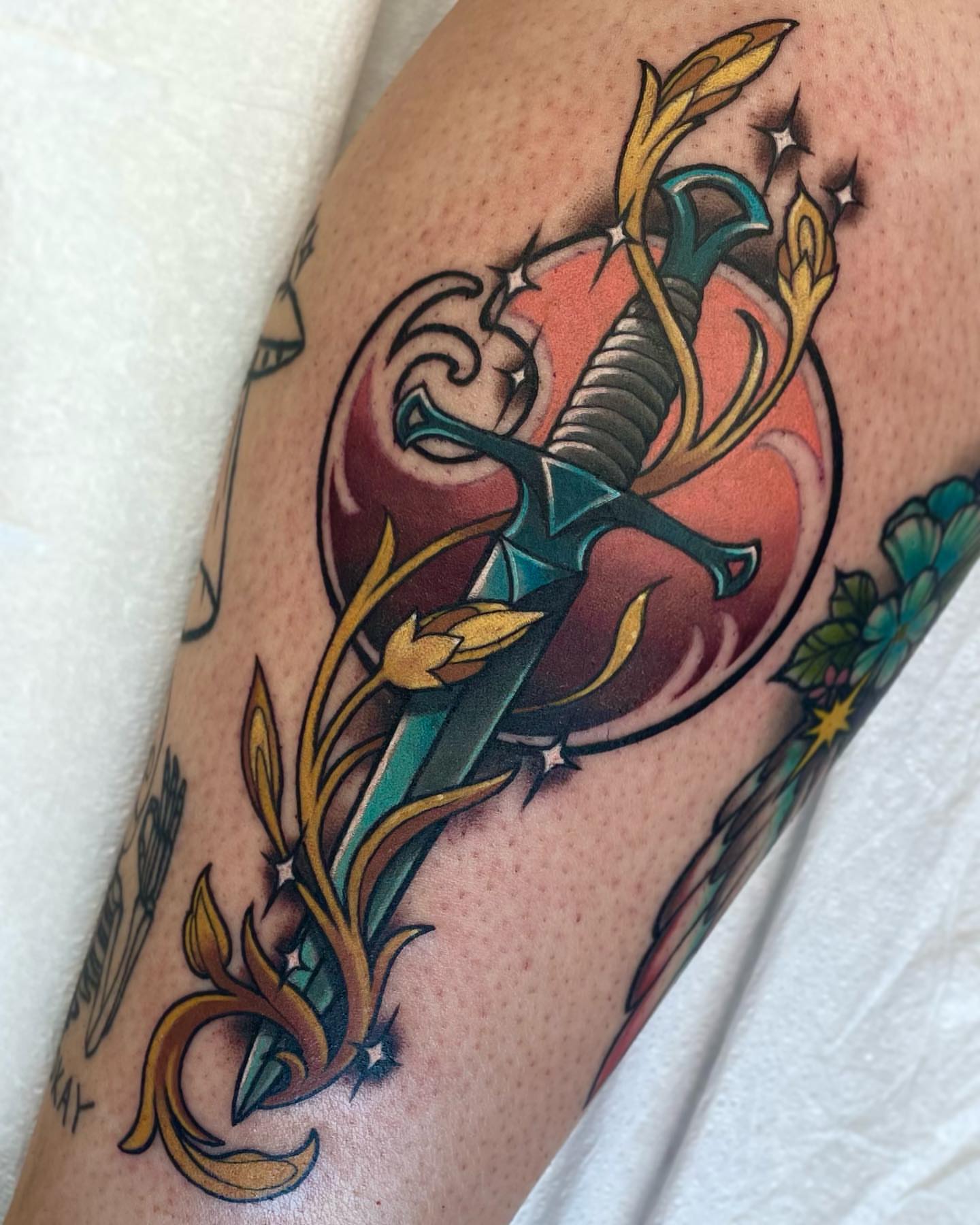 Sword and flame American traditional tattoo on the forearm by Bri