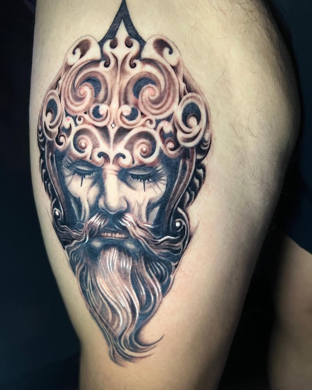Ornate bearded face surrealism tattoo on the thigh by Kayden DiGiovanni, Addison, Texas