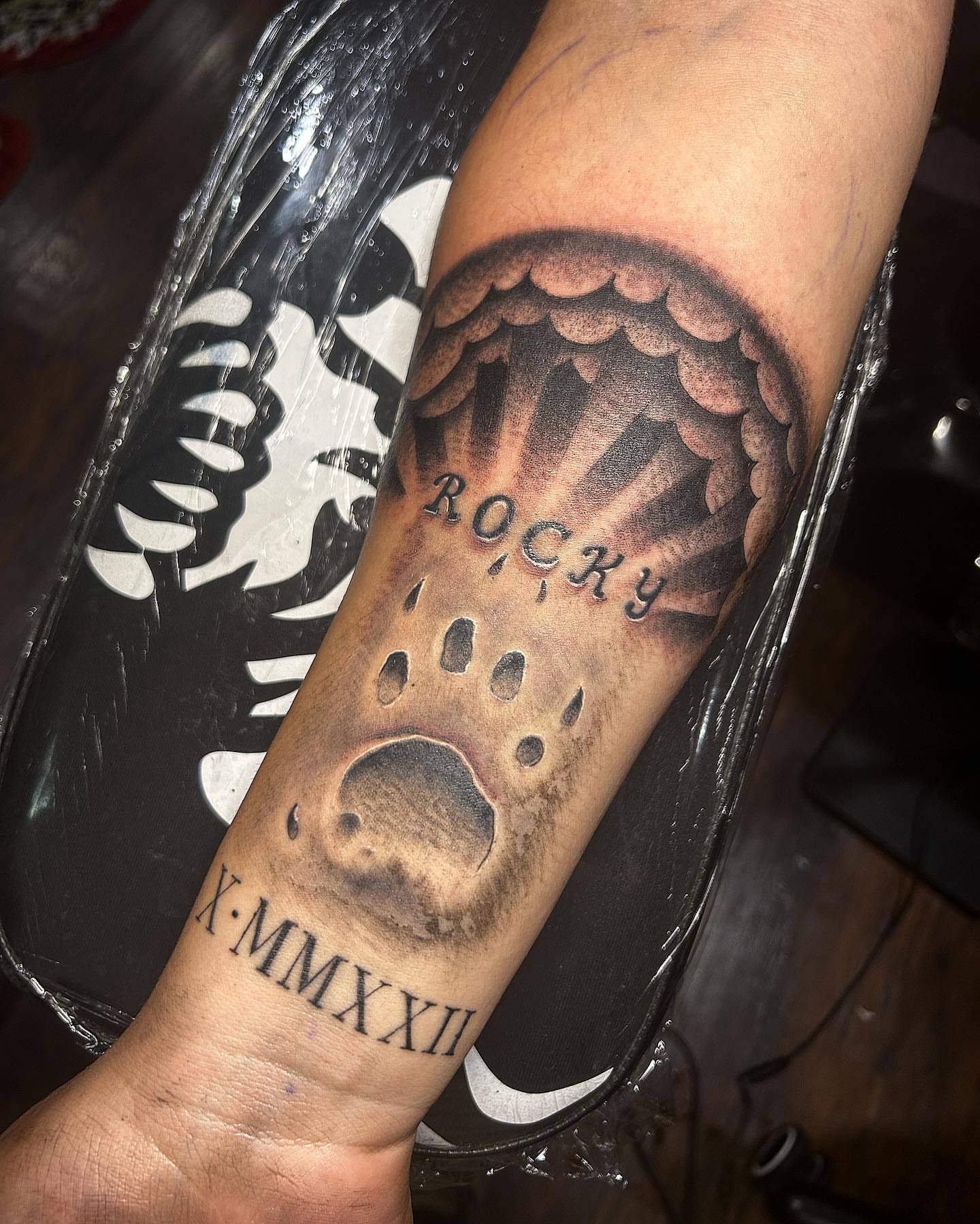 Rocky black and grey tattoo on the forearm by Visionary Tattoos