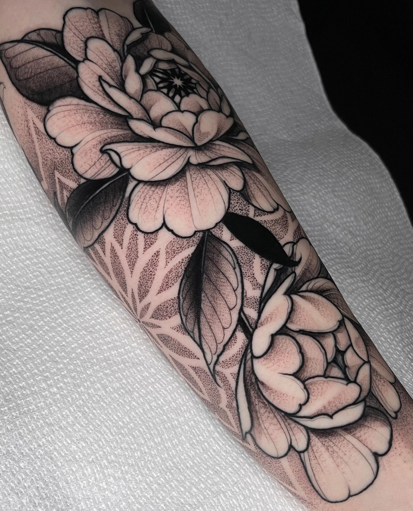 Peony flowers dotwork tattoo on the forearm by Las Vegas Tattoo Artist