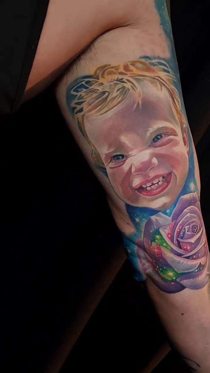 Child portrait with rose realism tattoo by Tyler Malek