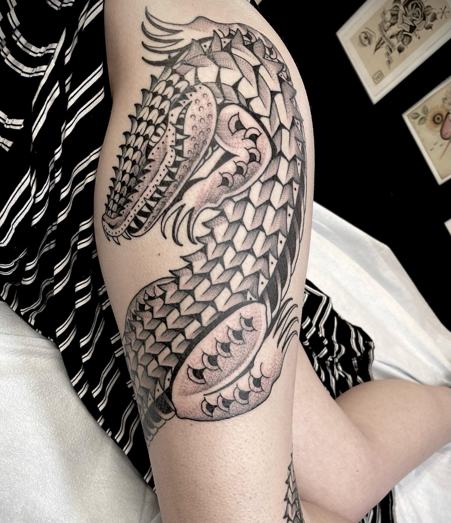 Serpent black and grey tattoo on the forearm by Jason Ryan