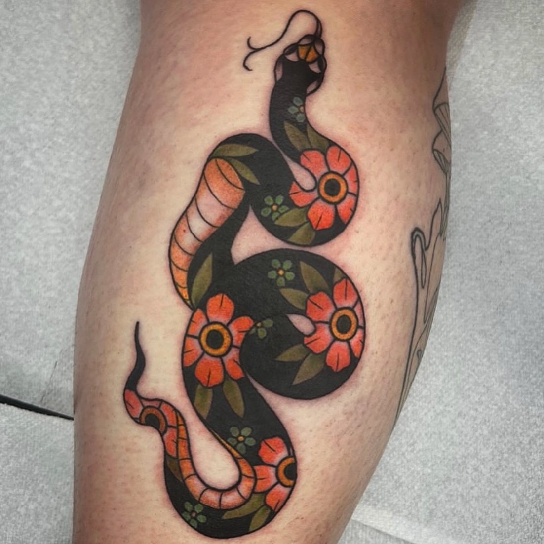 Snake American traditional tattoo on the leg by Danielle Dubois