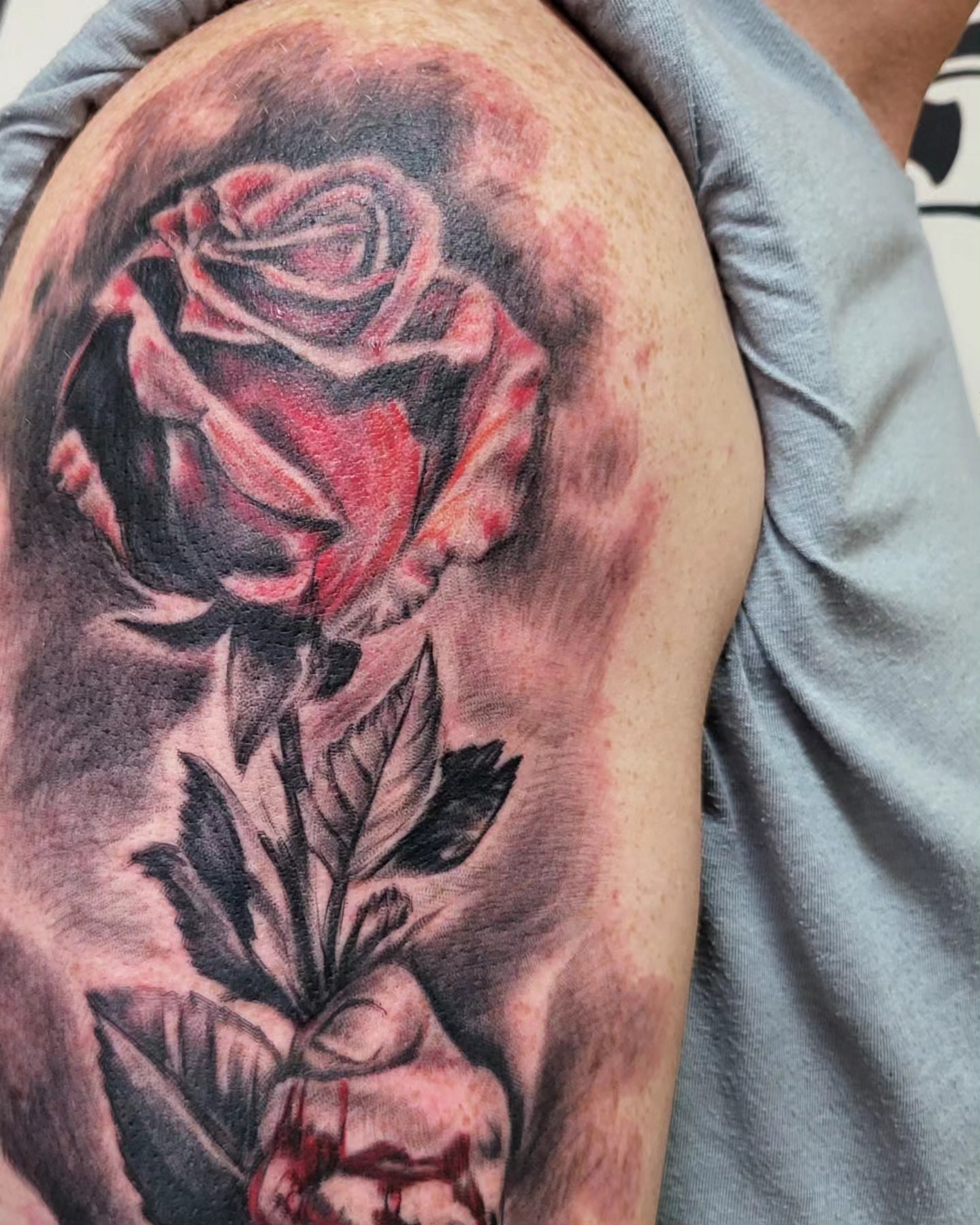 Rose realism tattoo on the shoulder by Mike Stamper