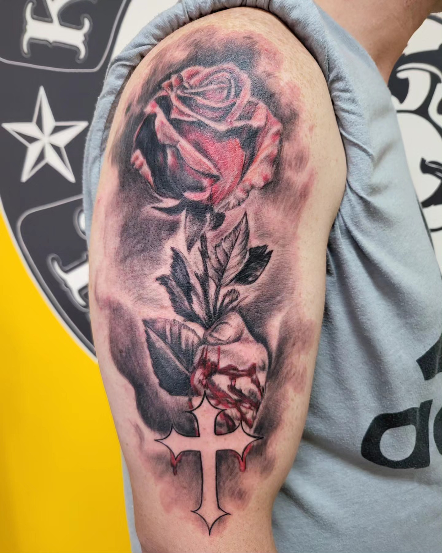 Rose and cross realism tattoo on the forearm by Mike Stamper
