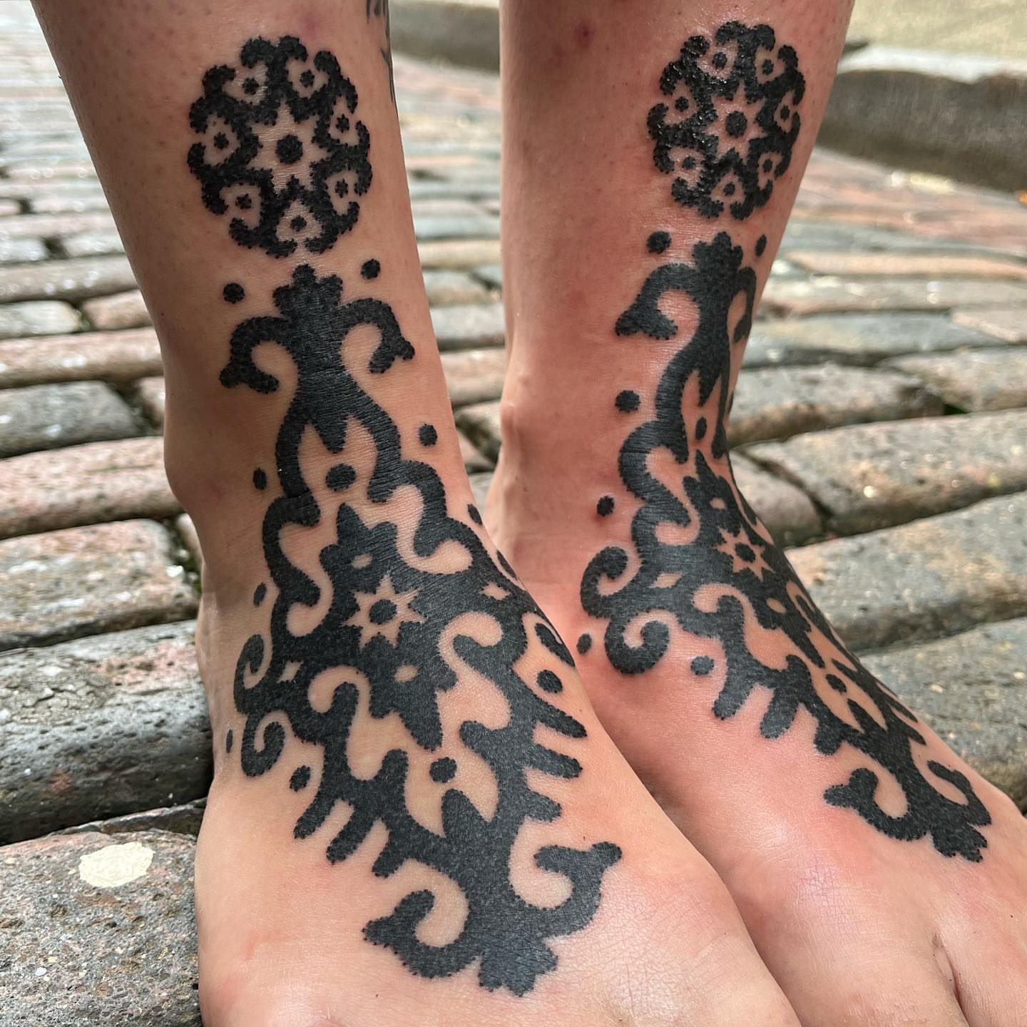 Floral pattern black and grey tattoo on the foot by kevvy