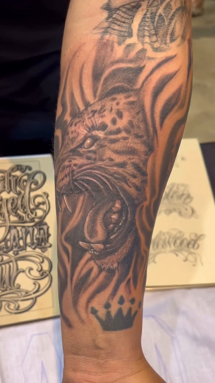 Leopard head with flames and crown realism tattoo by Look
