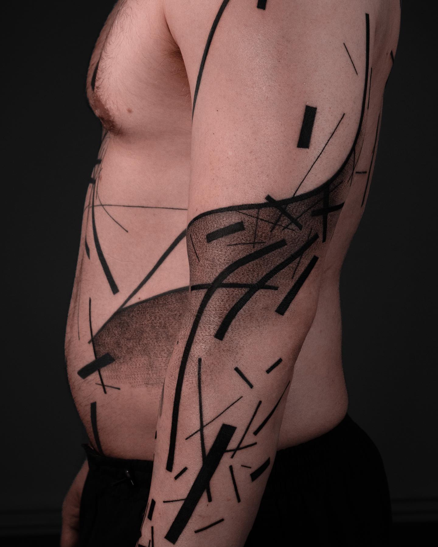Abstract geometric shapes geometric tattoo on the upper arm by Pietro Moleti
