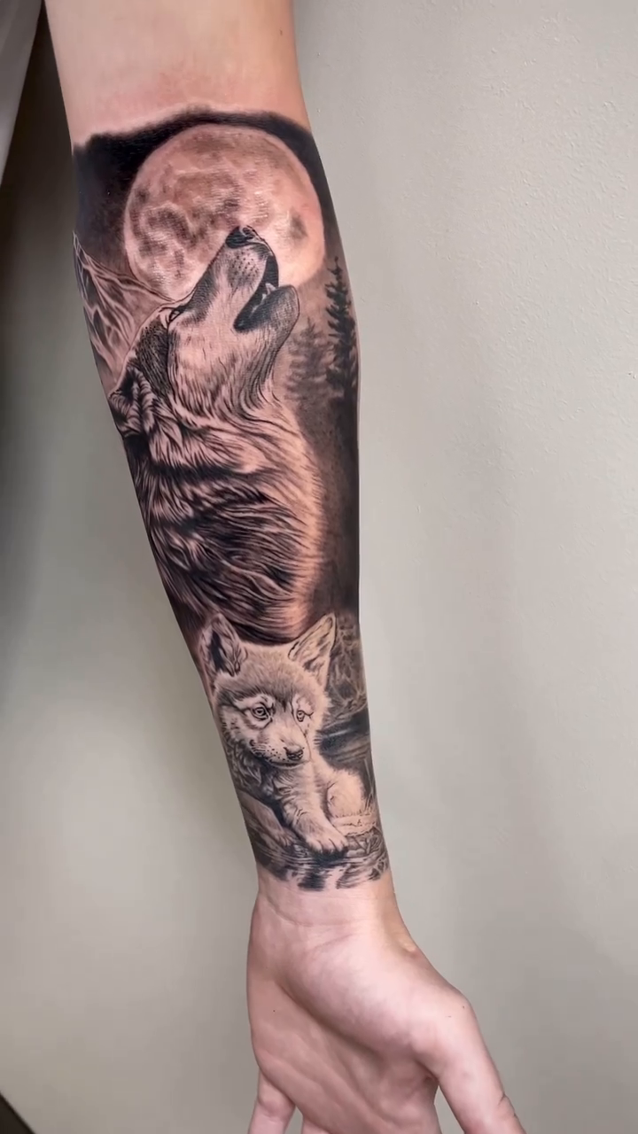 Wolf and cubs under the moon realism tattoo by Charlie