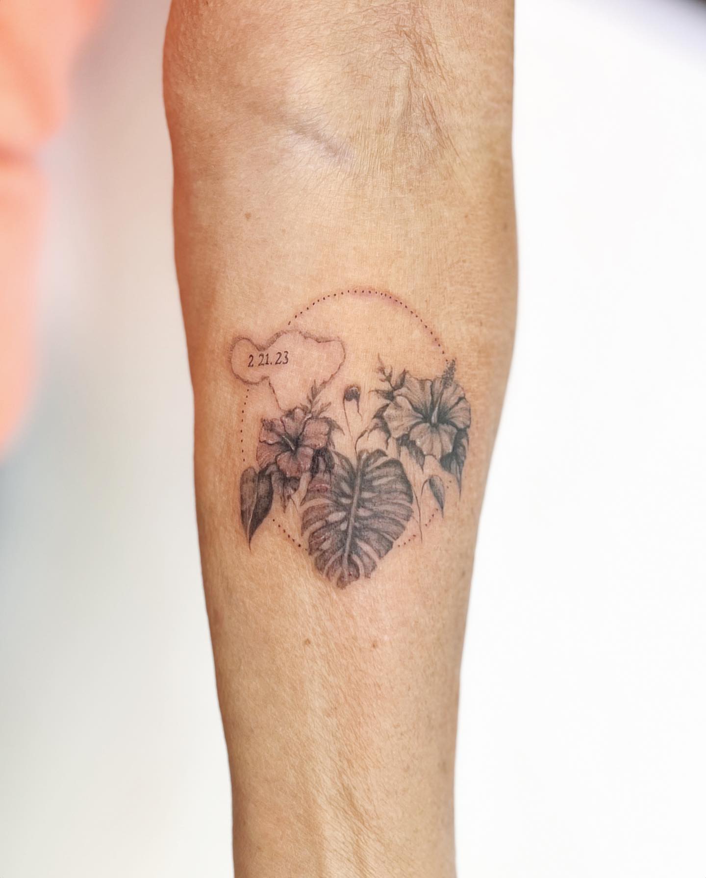 Flowers and leaves black and grey tattoo on the forearm by πππ¦