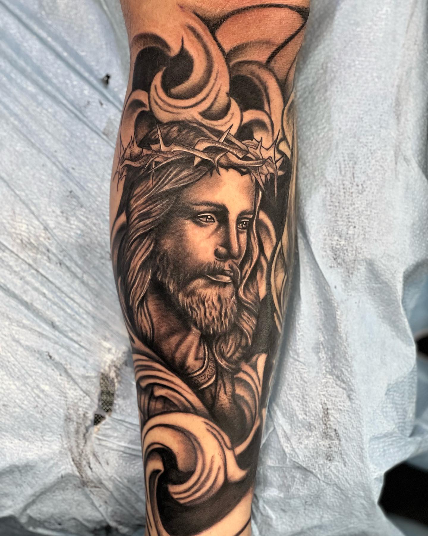Tattoo by @burkes.body.graphic — black_and_grey, realism