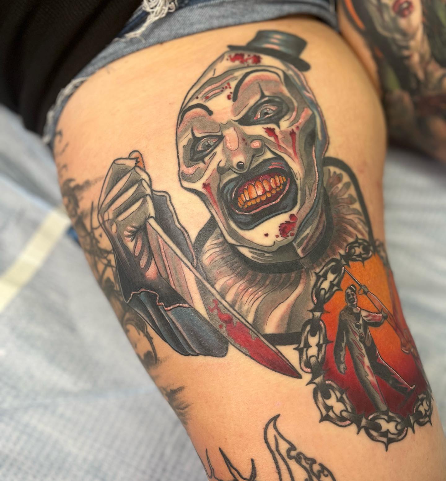 Clown with knife American traditional tattoo on the thigh by ๐๐๐๐๐๐๐