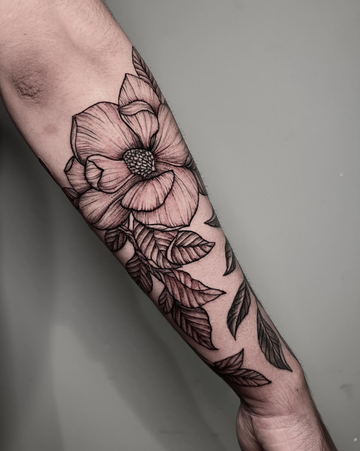 Flower black and grey tattoo on the forearm by Alex Shakuto Tattoo