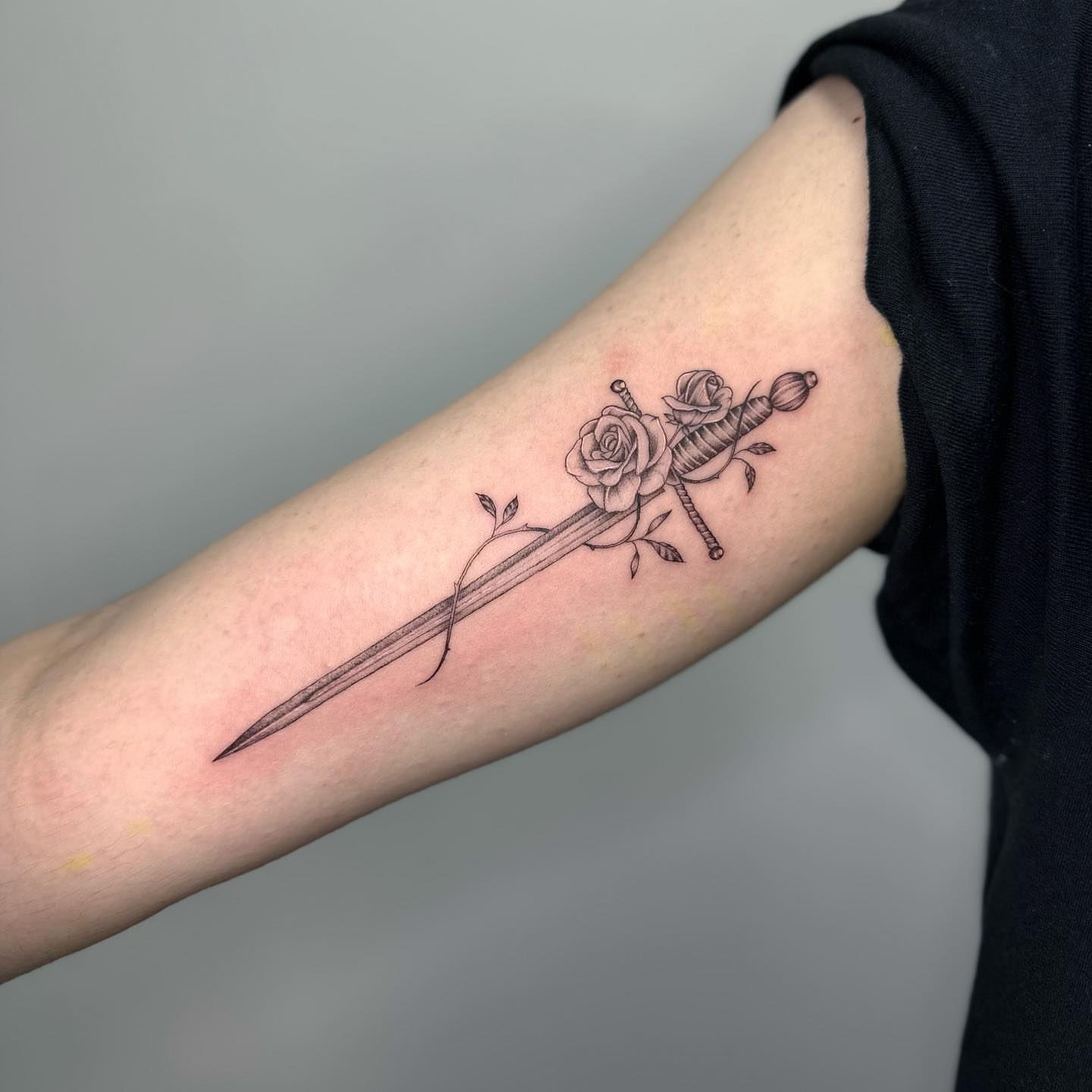 Sword and roses black and grey tattoo on the forearm by ๐๐๐๐ ๐๐๐๐