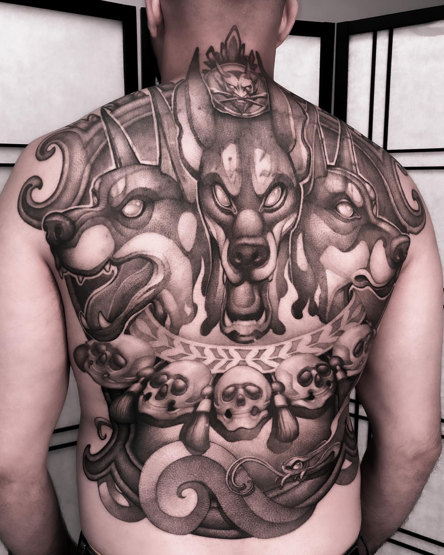 Three-headed dragon realism tattoo on the back by Tattoo artist in Charlotte,NC