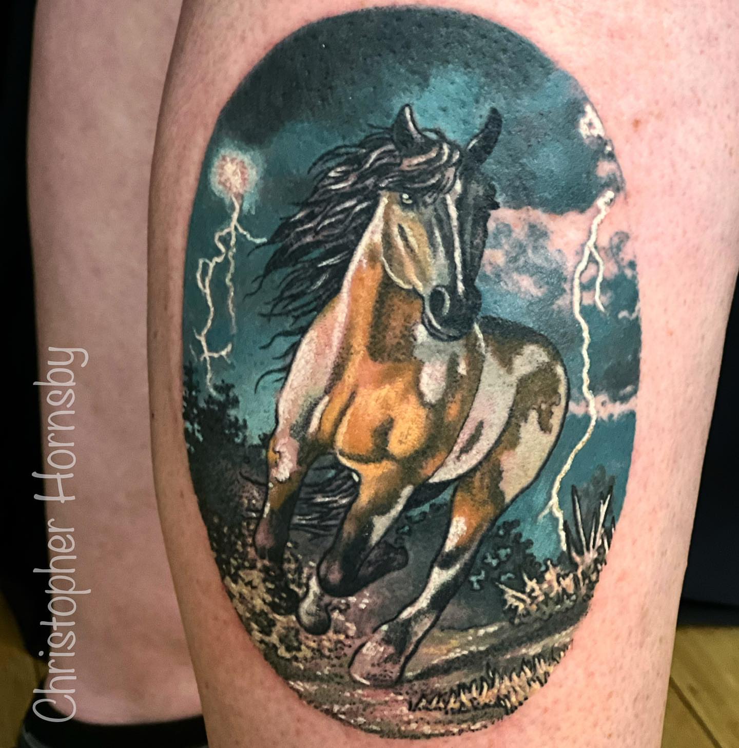 Galloping horse realism tattoo on the thigh by Chris Hornsby