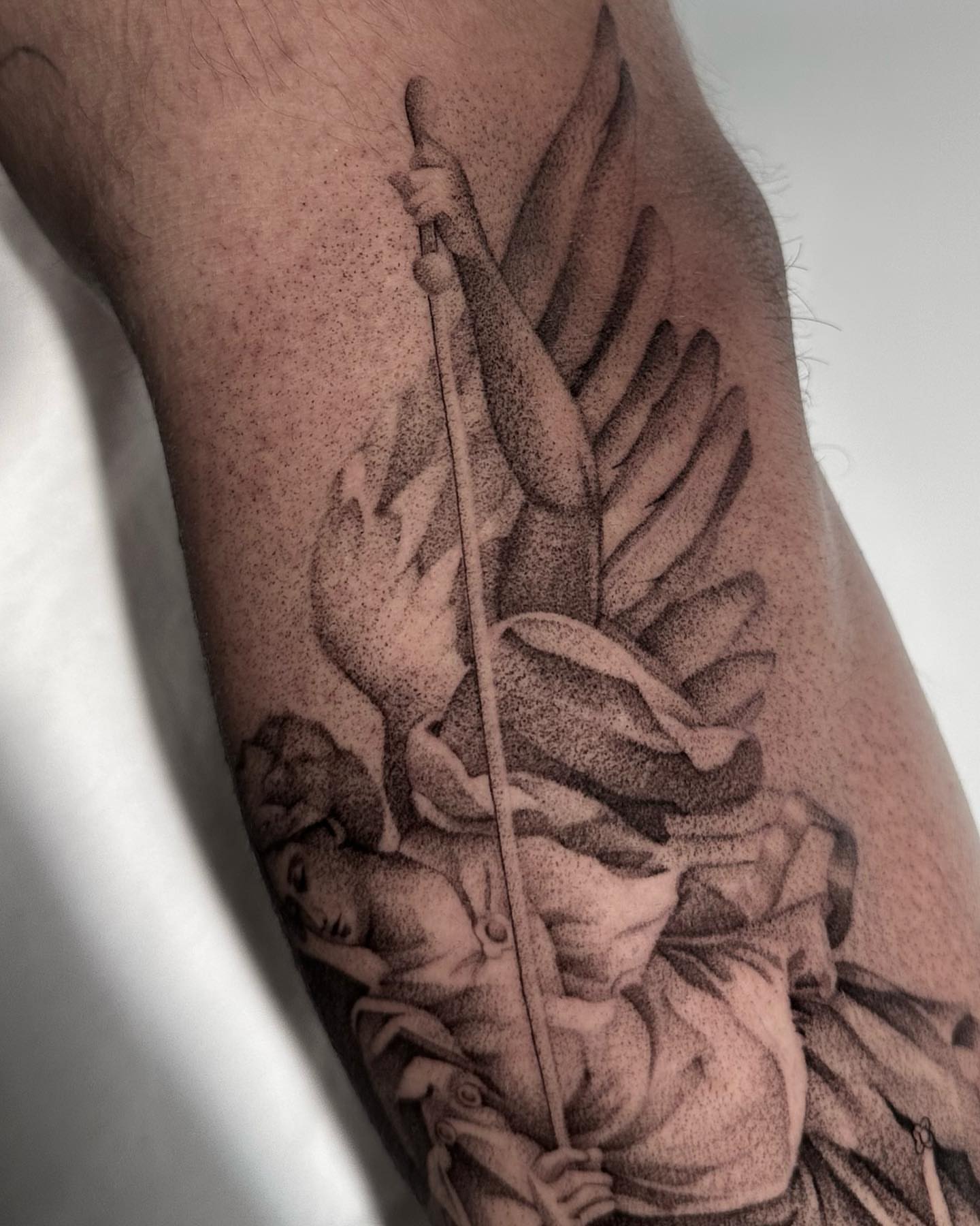 Angelic figure dotwork tattoo on the forearm by ᴰᴿᴬᴳᴼᴺ