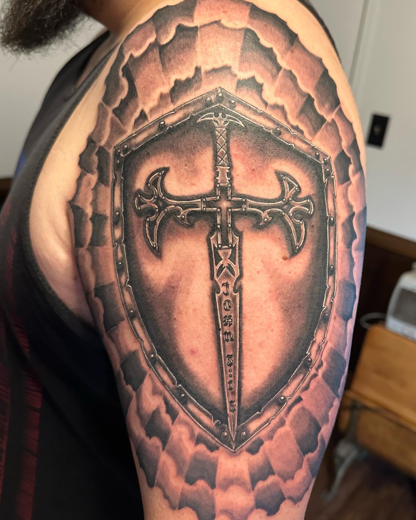 Cross and shield realism tattoo on the shoulder by las vegas tattoo artist