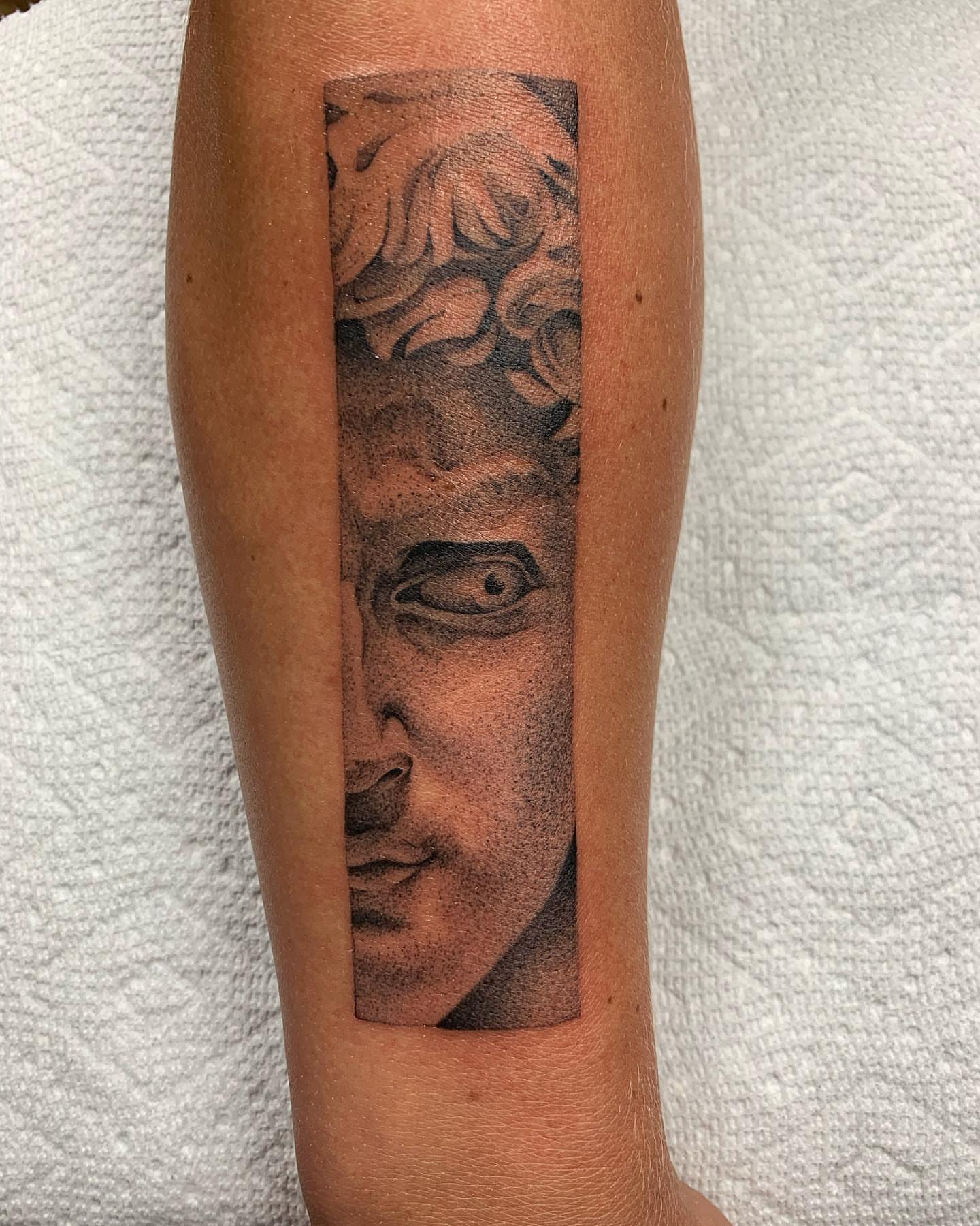 Portrait dotwork tattoo on the forearm by Jacob Deirfield, Circleville, Ohio