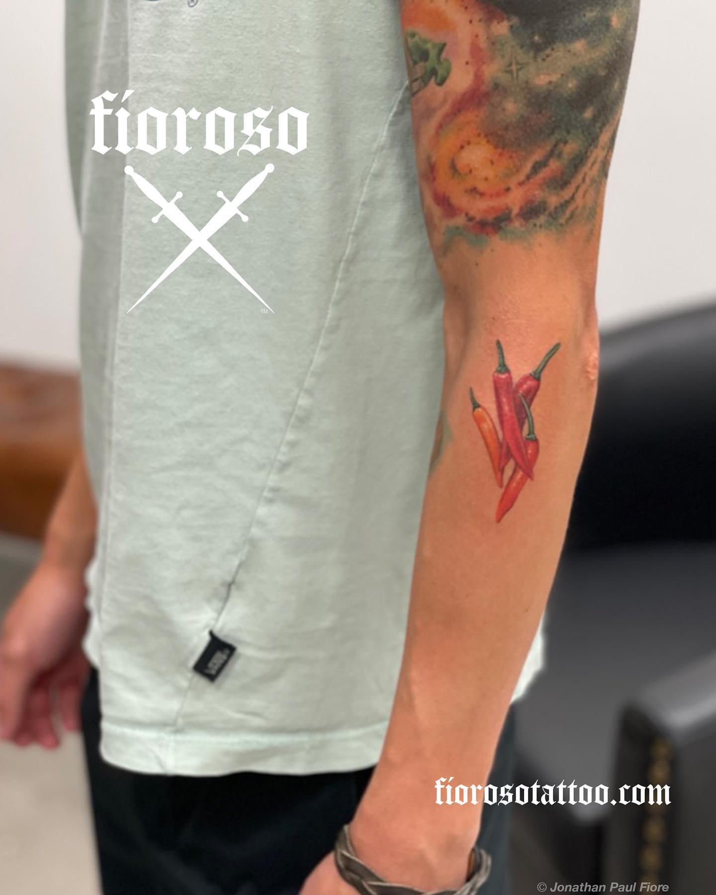 Chili peppers realism tattoo on the forearm by Jonathan Paul Fiore, Austin, Texas