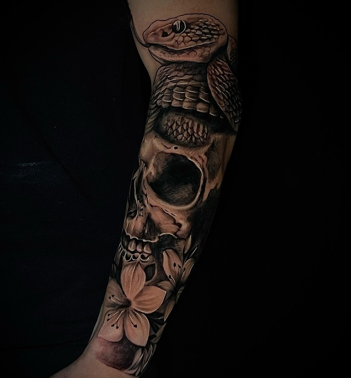 Snake and skull realism tattoo on the forearm by BillydaKid