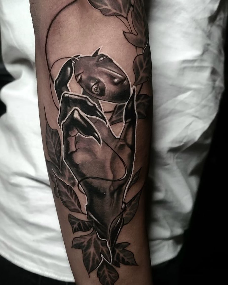 Panther black and grey tattoo on the forearm by Rain Delmar