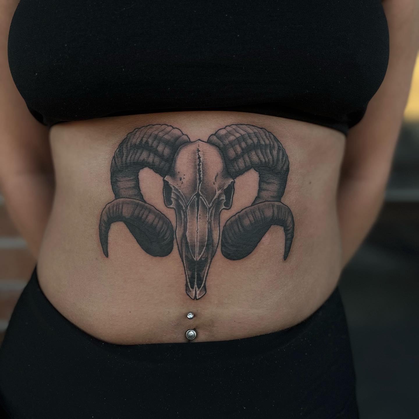 Ram skull black and grey tattoo on the torso by Myla Jane, Houston, Texas