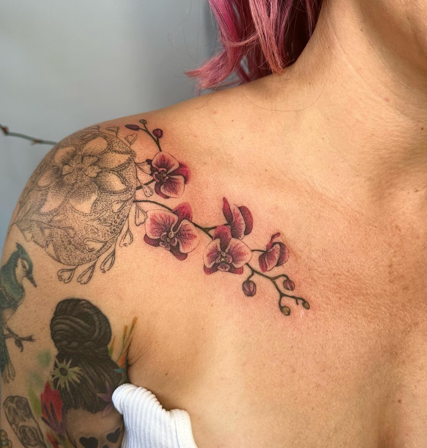 Orchid branch dotwork tattoo on the shoulder by 𓆏 Alyssa Carbonara 𓆏