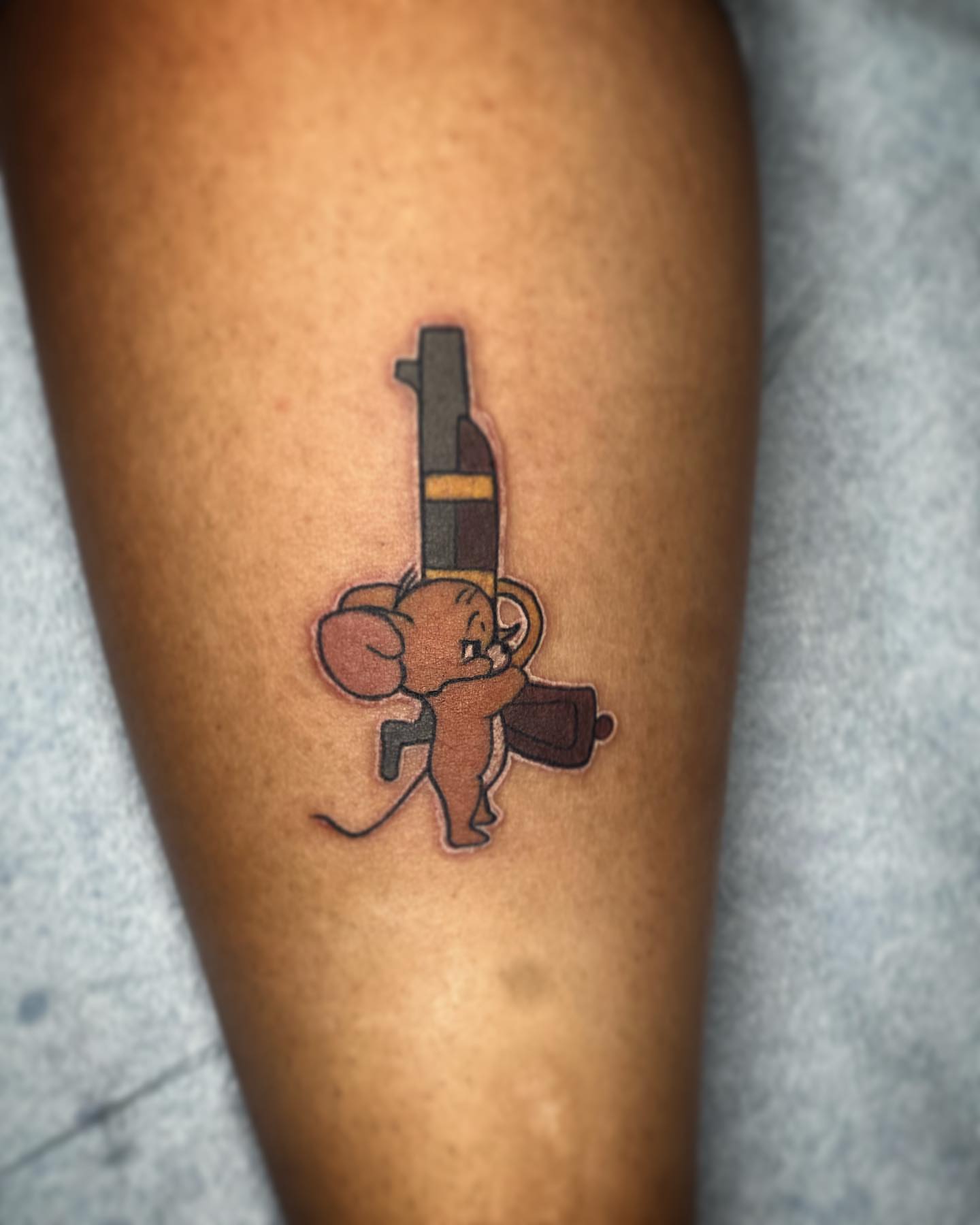Tom and jerry American traditional tattoo on the forearm by Alejandro Zaragoza