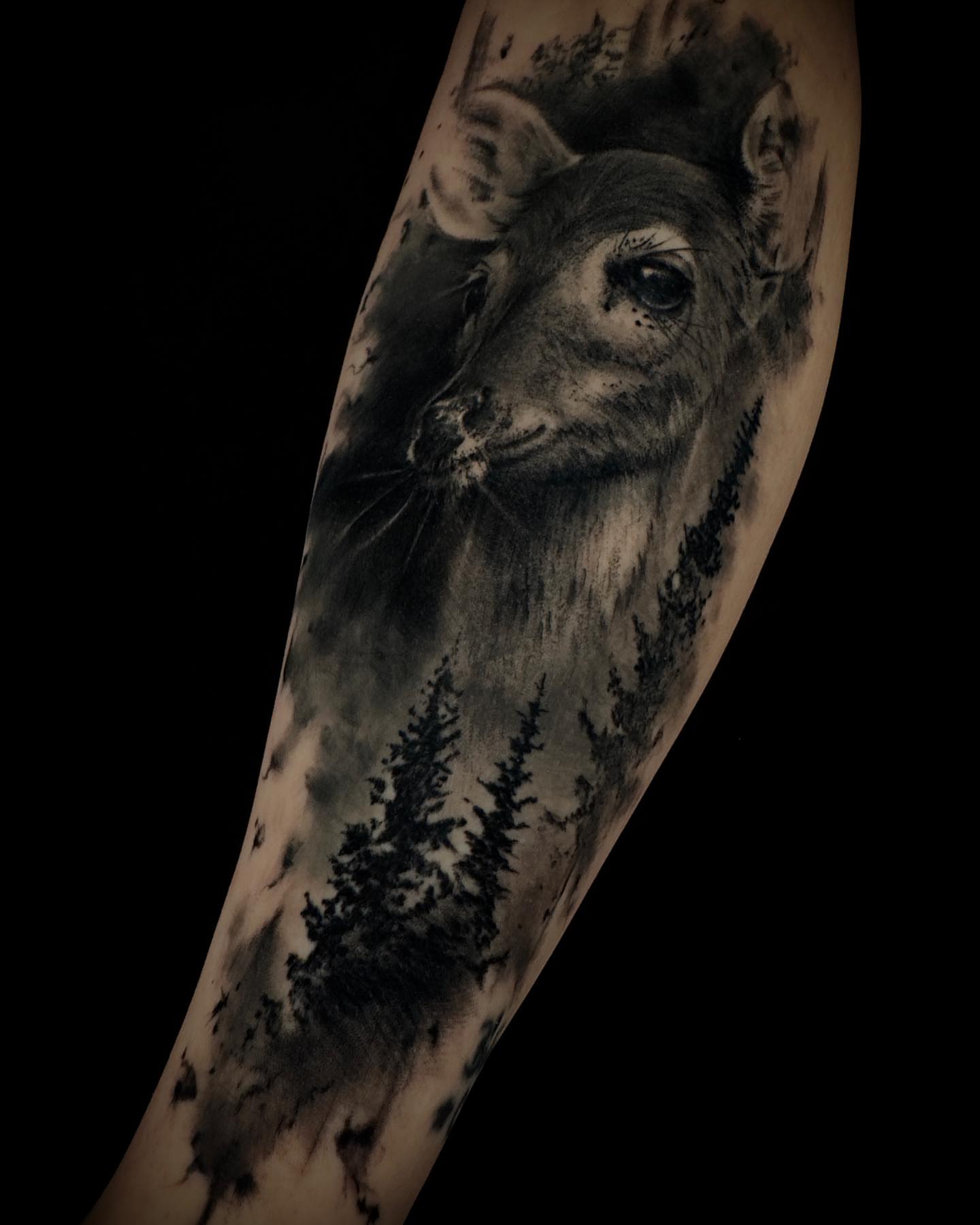 Deer realism tattoo on the forearm by Nic Luna