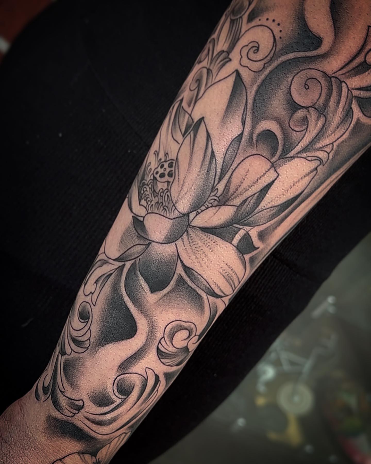Lotus flower dotwork tattoo on the forearm by Rachel Martinez