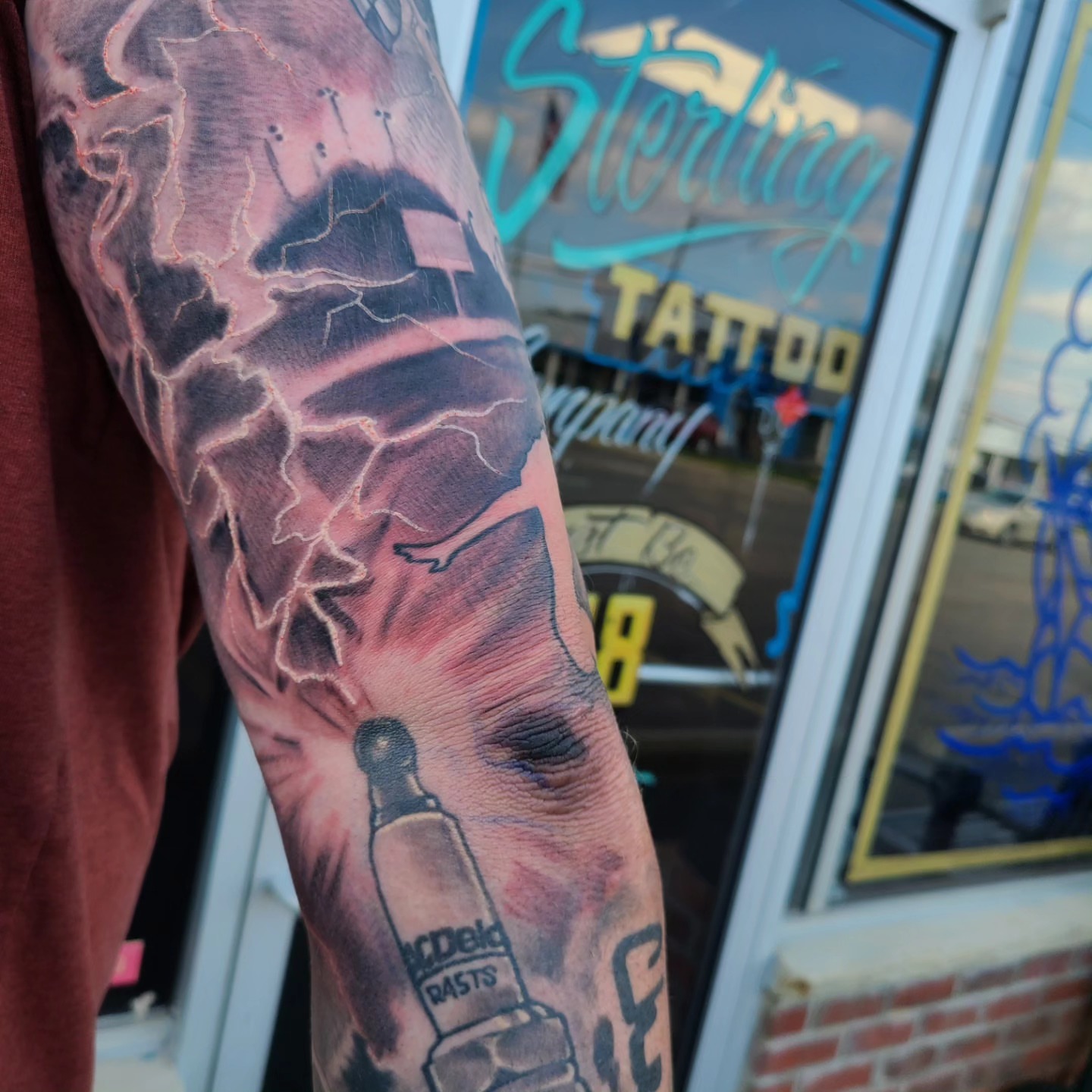 Lightning bolt realism tattoo on the forearm by David Johnson